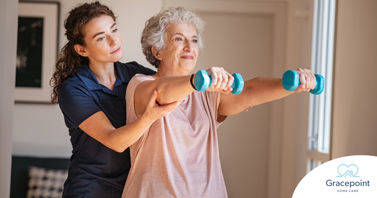 A physical therapist helps an older patient lift weights, representing how home health professionals can help with the hospital to home transition and the recovery that it entails.