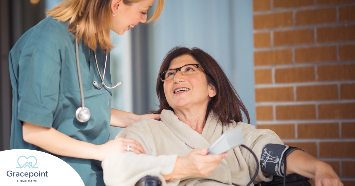 A happy home nurse helps a smiling patient in a wheelchair, representing how home health can help with pain management.