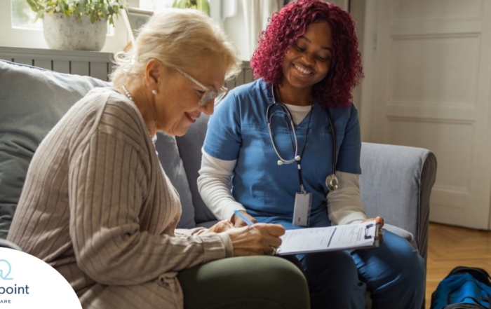 A healthcare professional helps an older patient fill out a form, representing what happens when the requirements for home health care eligibility are met.