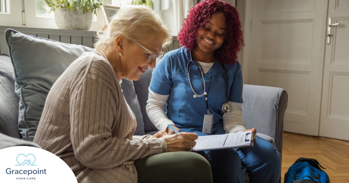 A healthcare professional helps an older patient fill out a form, representing what happens when the requirements for home health care eligibility are met.
