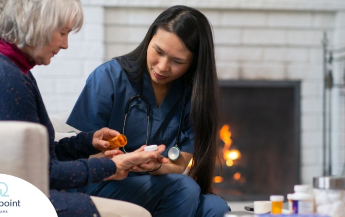 A nurse helps a patient at home with her medications, representing how home health nurses can help with disease management.