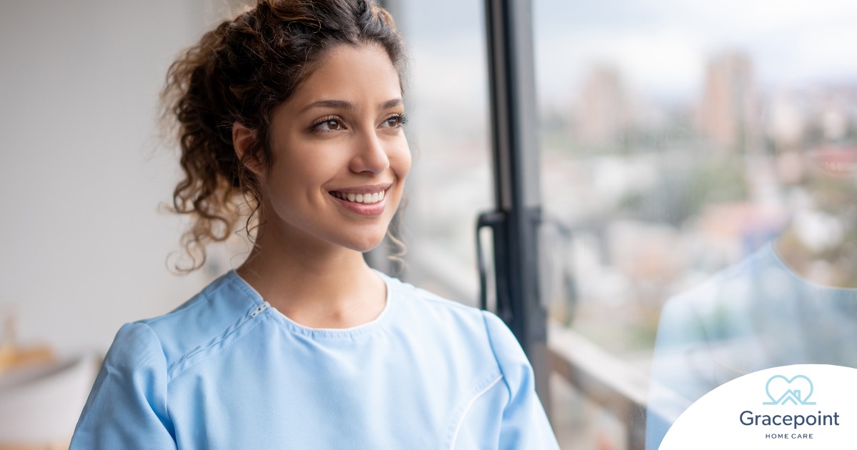 A woman smiles while looking ahead hopefully, showing the positive outlook that planning for a home care career can bring.