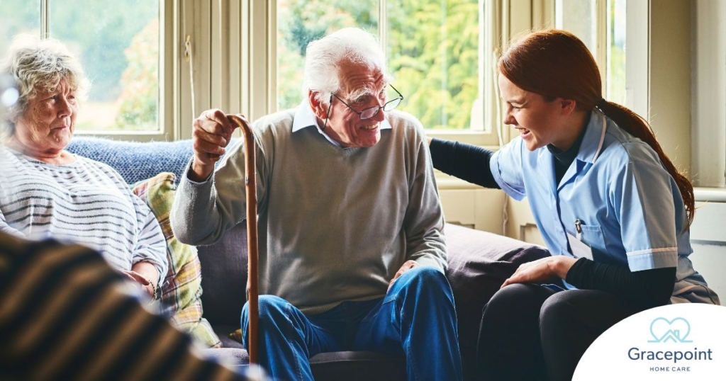 A woman has a good time with her older clients, representing the kind of personal skills needed to be a good caregiver.
