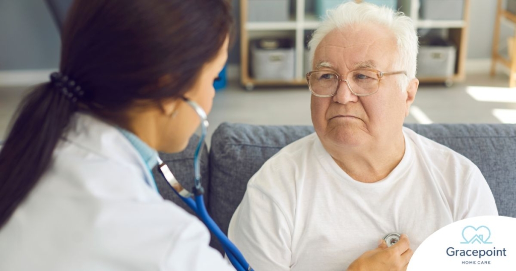 A doctor examines an older man with a stethoscope, representing pneumonia in elderly adults.