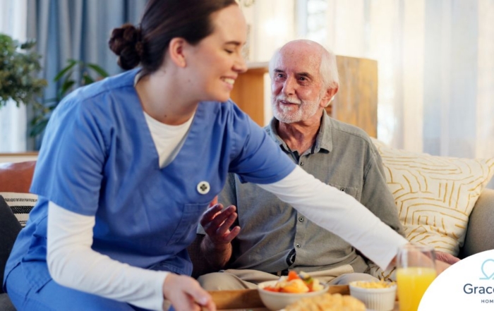 Caregiver providing senior care at home to manage parkinson’s and related symptoms.