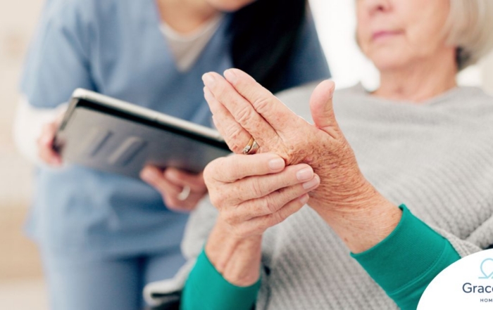 A caregiver provides in home care services to a senior with arthritis