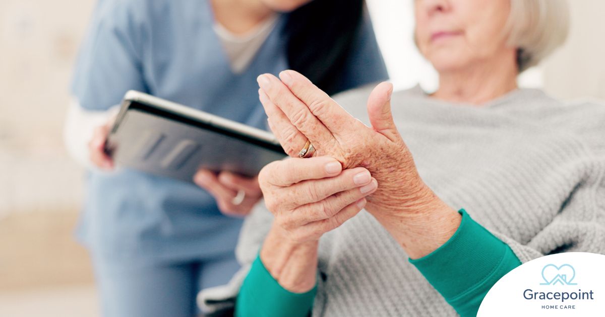 A caregiver provides in home care services to a senior with arthritis