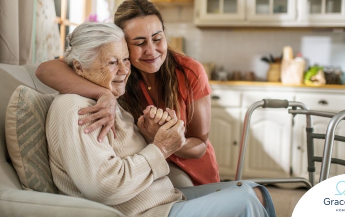 Caregiver supporting an elderly woman in the transition to senior home care