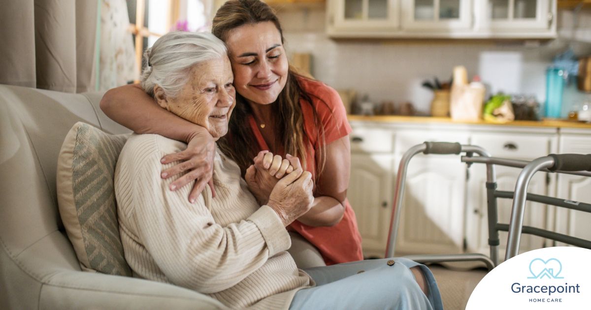 Caregiver supporting an elderly woman in the transition to senior home care