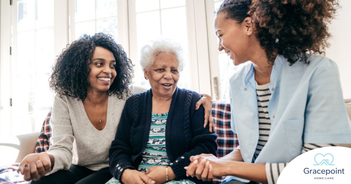Caregiver talking to a family about Elderly Care
