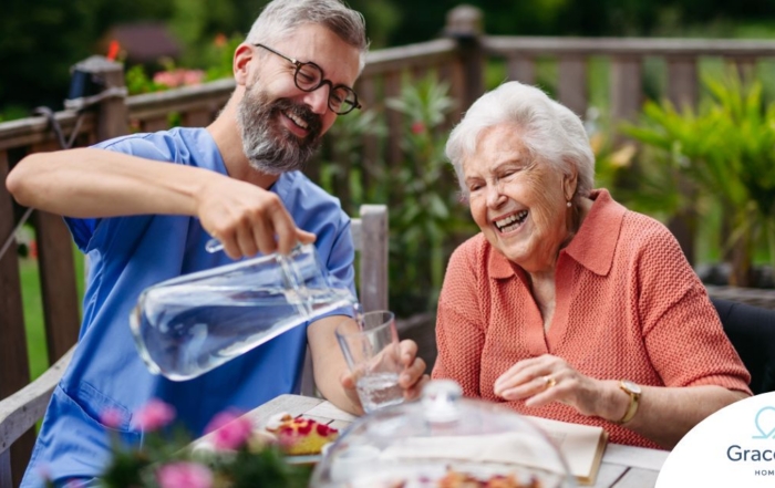A caregiver applies summer Caregiving Tips including helping a senior stay hydrated.